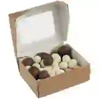 На картинке: Орехи в шоколадной глазури Sweetnut на белом фоне