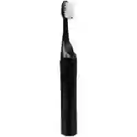 На картинке: Зубная щетка с пастой Push & Brush, черная на белом фоне